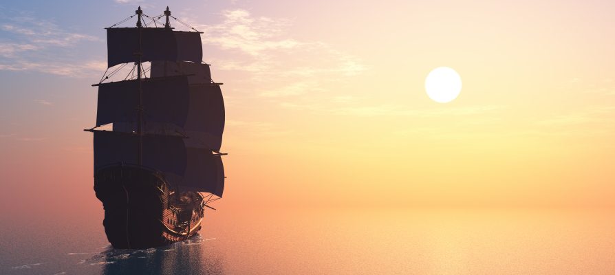 ship at sea and a big sun in the evening