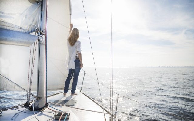 woman stand up in a boat