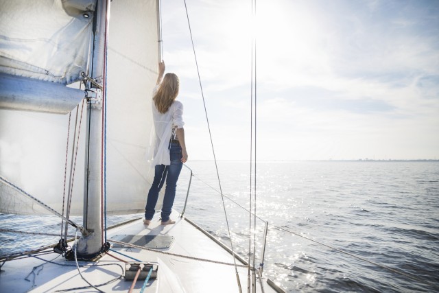 woman stand up in a boat