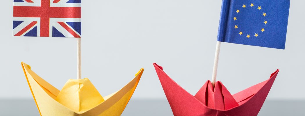 paper ship with british and european flag, concept shipment or free trade agreement and membership of eu, brexit