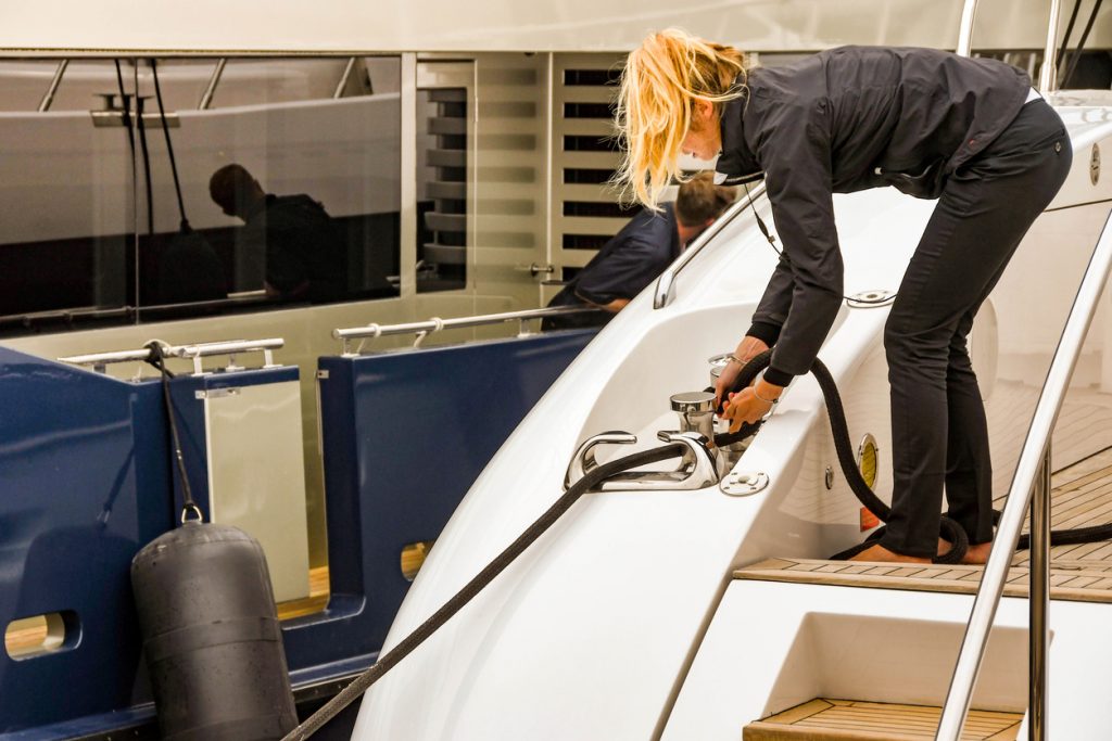 Female crew member working on a luxury yacht
