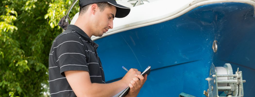 Man completely safety checks on a boat