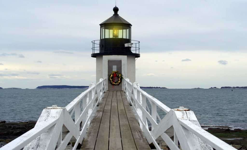 Lighthouse decorated for Christmas with a wreath 