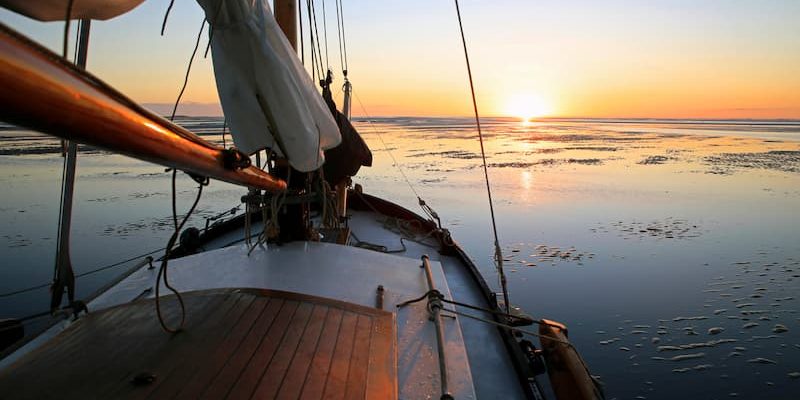 sailboat watching the sunset