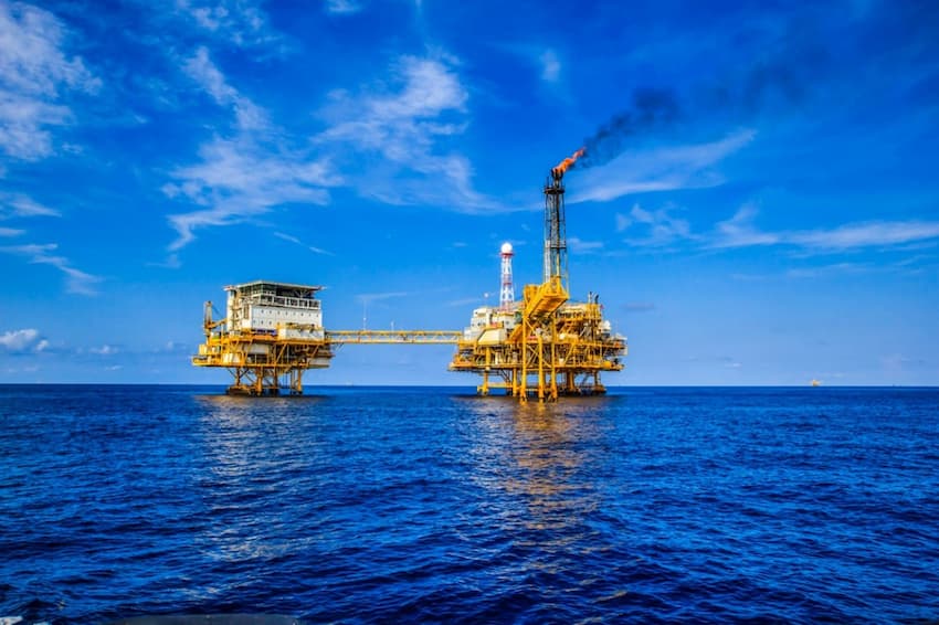 A large oil rig in the middle of the ocean