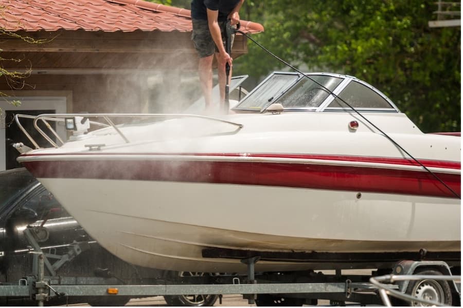 A person washing a boat