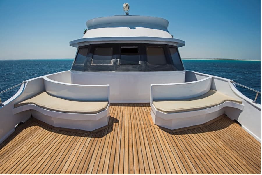 A deck of a boat with seats on it