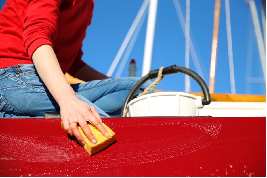 A person washing a boat