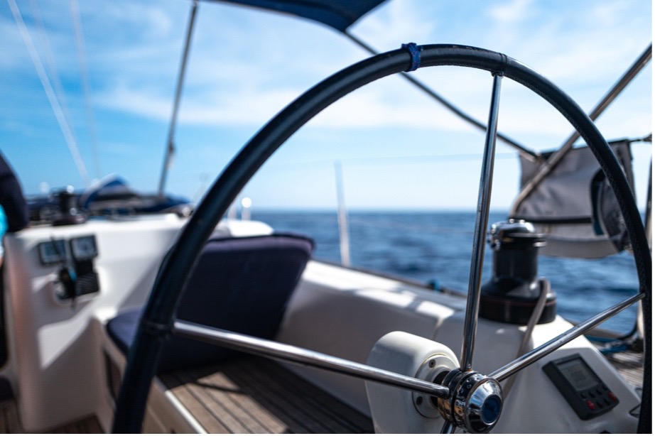 A steering wheel on a boat