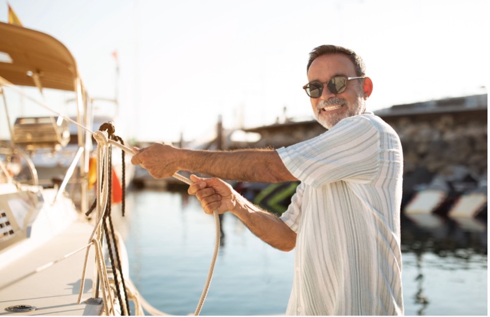A person holding a rope on a boat